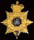 Royal Marines, an extremely fine and rare officer’s shako plate c1844-1855, the crowned copper gilt back plate...