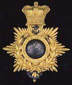 Royal Marine Light Infantry, a superb officer’s shako plate 1855-1866 the crowned copper gilt back plate with gilt...