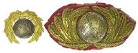 Royal Marines, an extremely fine large size officer’s forage cap badge being the globe in silver/silver gilt with...