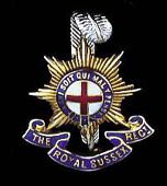 The Royal Sussex Regiment, a superb ‘cap badge’ example in 9ct gold, white gold and red white & blue enamels,...