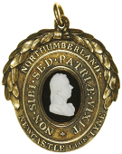 Newcastle upon Tyne (Northumberland) Pitt Club, an oval gilt badge, bust in white onyx on black onyx field,...