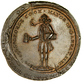 Lambeth, Prattent’s Penny, [17]96, standing figure of George Cook, smoking pipe and holding a mug and a keg, rev....