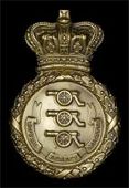 Royal Jersey Militia Artillery, a very rare other ranks die-stamped brass shako plate c1846-55, crowned circular...