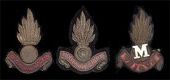 Glamorgan Militia Artillery, a very rare officer’s gold lace and crimson silk field service cap badge c1902, being...