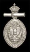 1st Worcestershire Artillery Volunteers, a special pattern plated white metal die-stamped sleeve (?) badge for...
