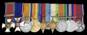 A rare and early Second World War D.S.O., inter-war M.V.O. group of nine awarded to Commander E. L. Woodhall, Royal...