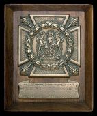 South African Memorial Plaque, bronze cross, 76 x 76mm., mounted on a wooden base, with a label below inscribed,...