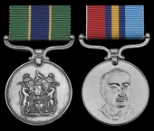 A rare “Gallantry” Rhodesia Police Meritorious Service Medal (P.M.M.) pair awarded to Auxiliary Constable...