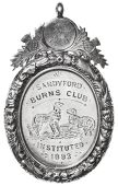 Sandyford Burns Club (Inst. 1893), an oval silver engraved award medal, two dogs, portrait of Robert Burns in...
