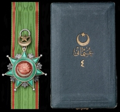Ottoman Empire, Order of Osmania, 4th Class breast badge, 57mm., silver, silver-gilt and enamel, with a length of...