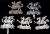 The Buffs (East Kent Regiment) Officers’ Cap Badges. Comprising a fine quality example in H/M silver (Birmingham...