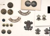 The Prince of Wales’s Leinster Regiment (Royal Canadians) Insignia. Comprising a pair of brass s/titles...