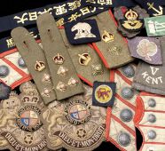 Miscellaneous Cloth Insignia. A large parcel including the coat tail pocket sections and one cuff section from an...