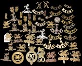 East and West Kent Regimental Insignia. Comprising glengarries to the 50th Regiment (lugs missing) and 97th...