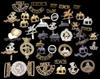South Wales Borderers and West Riding Regimental Insignia. The former comprising an officer’s waist belt clasp...