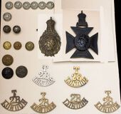 The Artists’ Rifles Insignia. Comprising a blackened brass pouch belt plate and corresponding helmet plate to the...