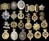Miscellaneous Militaria. A quantity of reproduction and defaced military badges, a small collection of cloth...