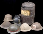 Steel Helmets. Comprising four British examples (one a relic and lacking all lining etc.,), one with painted badges...