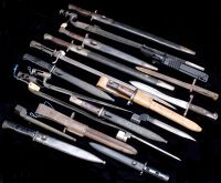 Bayonets. Assorted examples mainly European late 19th C to late 20th C, twelve with scabbards, four in relic state,...
