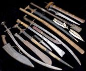 Assorted Edged Weapons. Fourteen examples including two Spanish navajas, a kris (hand grip section missing), 1940...