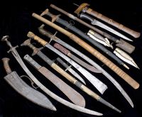 Assorted Edged Weapons. Fourteen examples including two Spanish navajas, a kris (hand grip section missing), 1940...