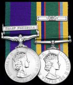 Pair: Squadron Leader E. S. Dodds, Royal Air Force Volunteer Reserve (T.), late Royal Air Force, who flew Canberras...
