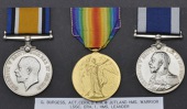 Three: Acting Chief Engine Room Artificer 2nd Class G. Burgess, Royal Navy, killed in action on H.M.S. Warrior at...