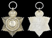Indian Title Badge, G.V.R., ‘Khan Bahadur’, silver-gilt, reverse inscribed, ‘Jam Kambhu Khan, 1st Jany....