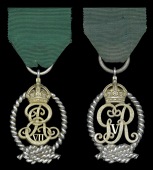 Royal Naval Reserve Decoration (2), E.VII.R., hallmarks for London 1909, in Garrard, London case of issue; another,...