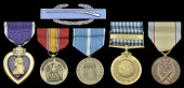 A Purple Heart group of five named to Corporal Rolland P. Landwehr, 19th Infantry Regiment, 24th Infantry Division,...