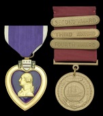 A Purple Heart/Long Service Medal pair awarded to Chief Pharmacist’s Mate Charles Anthony DiGiacinto, U.S. Navy,...