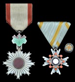 Japan, Order of the Rising Sun, 6th Class breast badge, silver and enamel with red cabochon centre, in hinged...