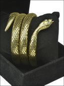An 18ct gold and diamond sprung serpent bangle, of coiled formation, the head inset with two brilliant-cut diamond...