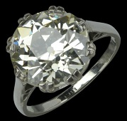 A single stone diamond ring, the old brilliant-cut diamond, weighing 6.08 carats, in eight double-claw setting,...