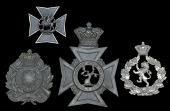 Monmouthshire Rifle Volunteers Insignia 1859 - 1885, the first a shako plate in die stamped blackened brass...