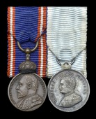 An unattributed mounted group of two miniature dress medals worn by a member of the Royal Household

Royal...