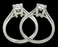 A Harry Winston single stone signature diamond ring, the brilliant-cut diamond weighing 0.58 carats, in platinum...