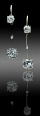 A pair of diamond drop pendent earrings, each composed of an old-cut diamond surmount, with two section knife-edge...