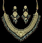 An Indian diamond and gem set necklace and earpendant suite, the necklace of foiled back lasque-cut diamond set...