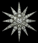 A Victorian diamond star brooch, gold and silver mounted, and set throughout with cushion-cut and old-cut diamonds,...