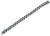 An 18ct white gold sapphire and diamond bracelet, the articulated bracelet composed of diagonally set pairs of...