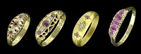 Four late 19th/early 20th century ruby, red stone and diamond rings, comprising a ruby five stone ring with rose-cut...
