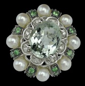 A green quartz and gem set dress ring, the oval double rose-cut pale green quartz claw set within a flowerhead...