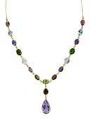 A multi gem set necklace, composed of linked spectacle set slightly graduated mixed-cut tourmalines, blue topaz,...