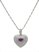 A diamond and pink sapphire heart-shaped pendant on chain, the slightly domed heart-shaped pendant pavé set with...