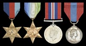 Family Group:

Three: Engine Room Artificer 4th Class R. Hobbs, Royal Navy, killed in action when H.M.S. Hood, the...