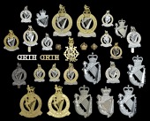 Queen’s Royal Irish Hussars Insignia, comprising two officers gilt and silver plated cap badges with 1.5 pairs of...