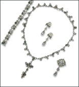 A Portuguese emerald, diamond and pearl matched suite, comprising a necklace with detachable pendant drop, a...