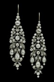 A pair of diamond chandelier earpendants, the 18th century style articulated tapered earpendants of foliate design,...