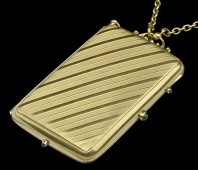 A French early 20th century gold vanity case/minaudière, the rectangular case with diagonal banding to the...